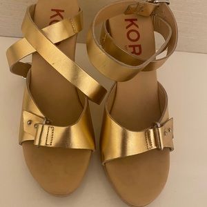 Gold leather platform Kors heels.